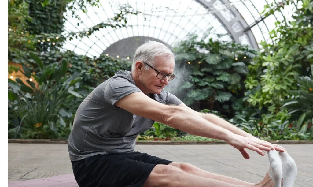 older guy stretching - stretching exercises for men over 50