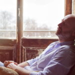 Man sitting and thinking- Problems Men Face When Growing Older