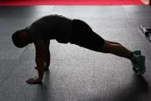 Guy doing planks - belly fat reduction for men over 50