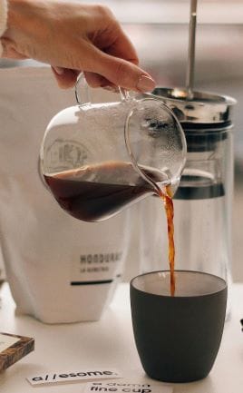 pouring coffee into a cup 
