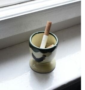 Cigarette in cup - Types of Habits