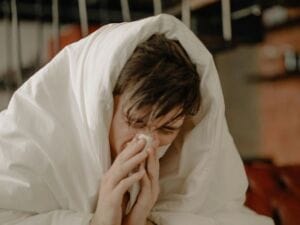 Man with cold - sleep boosts your immune system