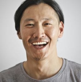 a man laughing - look better by smiling or laughing