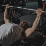 man doing bench press 0 muscle tear and repair