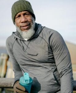 man outside with water bottle