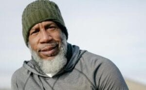 man outside with water bottle